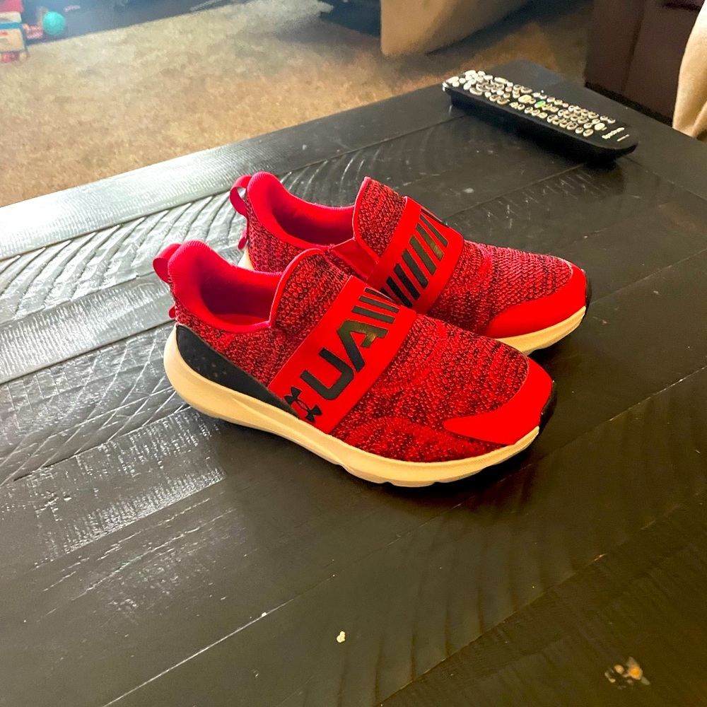 Boys size 4 under Armour sneakers. Red, no tie. Never worn.